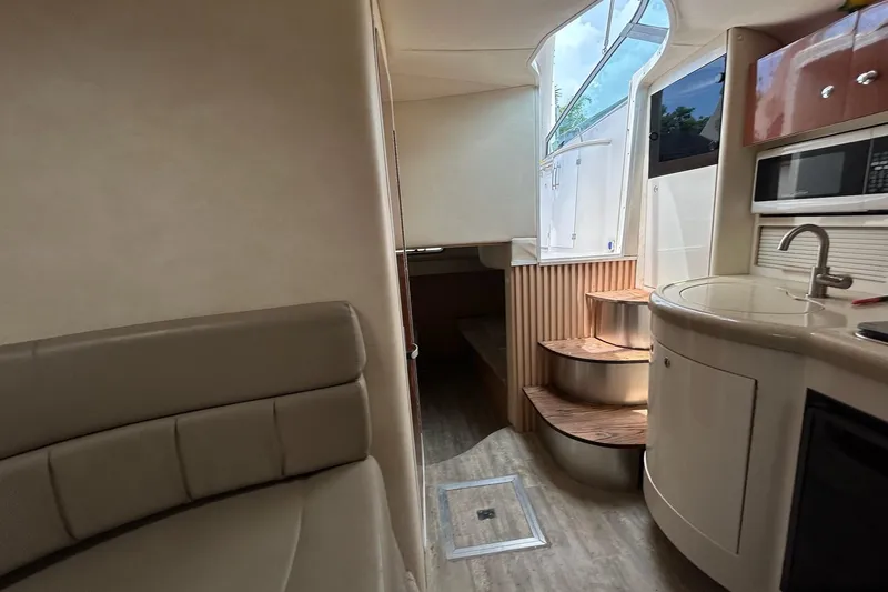 Slide: The Image of Interior of 2000 Monterey 330 Sport Yacht with kitchenette and seating area. - 51