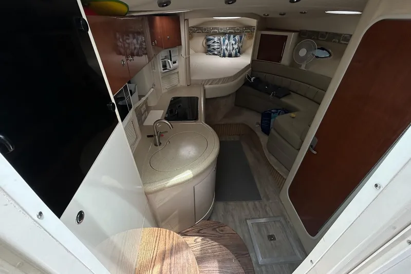 Slide: The Image of Interior of 2000 Monterey 330 Sport Yacht with kitchenette and seating area. - 37