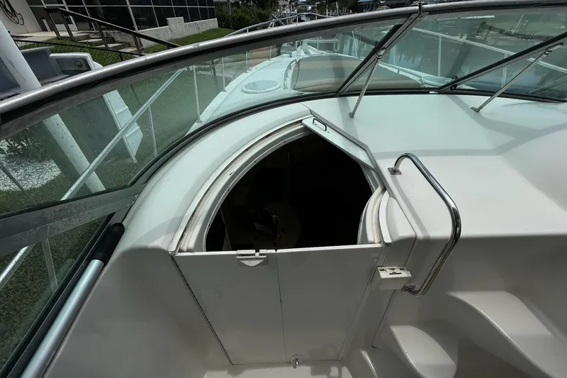 Slide: The Image of 2000 Monterey 330 Sport Yacht cabin entrance with sleek design and stainless steel railing. - 31
