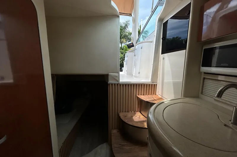Slide: The Image of Interior view of 2000 Monterey 330 Sport Yacht with stairs and kitchenette. - 52
