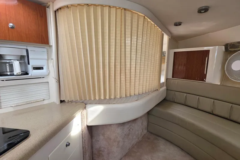 Slide: The Image of Interior of 2000 Monterey 330 Sport Yacht with kitchenette and seating area. - 62