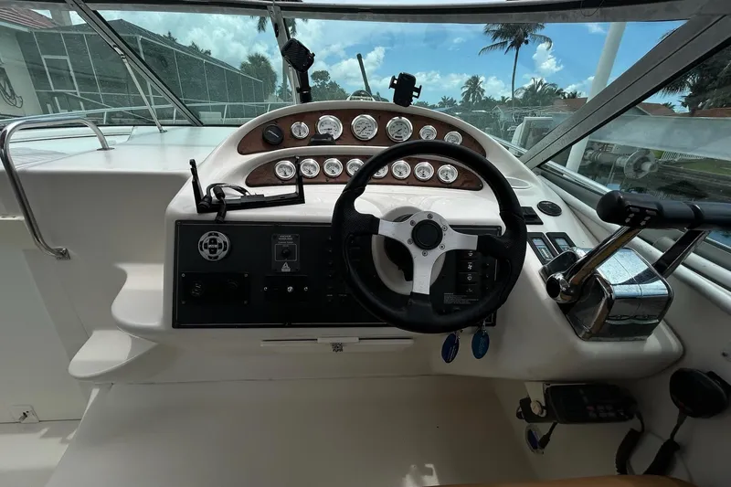 Slide: The Image of Cockpit of 2000 Monterey 330 Sport Yacht with steering wheel and control panel. - 20