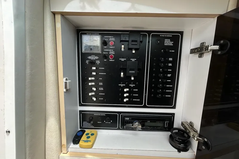 Slide: The Image of Electrical control panel of a 2000 Monterey 330 Sport Yacht with switches and gauges. - 42