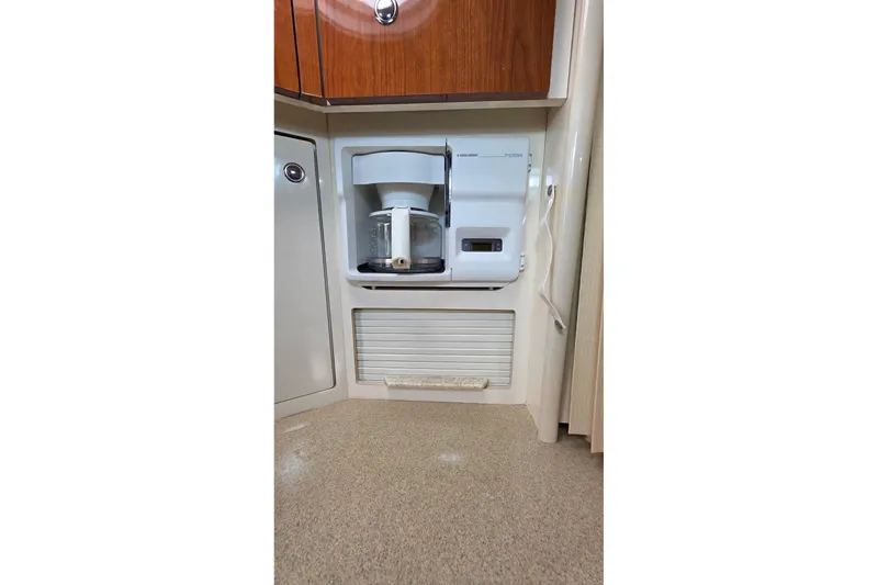Slide: The Image of Built-in coffee maker in a 2000 Monterey 330 Sport Yacht kitchen area. - 64
