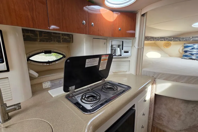 Slide: The Image of Interior of 2000 Monterey 330 Sport Yacht with kitchenette and cozy sleeping area. - 58
