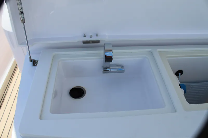 Slide: The Image of Axopar 37 XC Cross Cabin Brabus 2022 onboard sink and faucet. - 28
