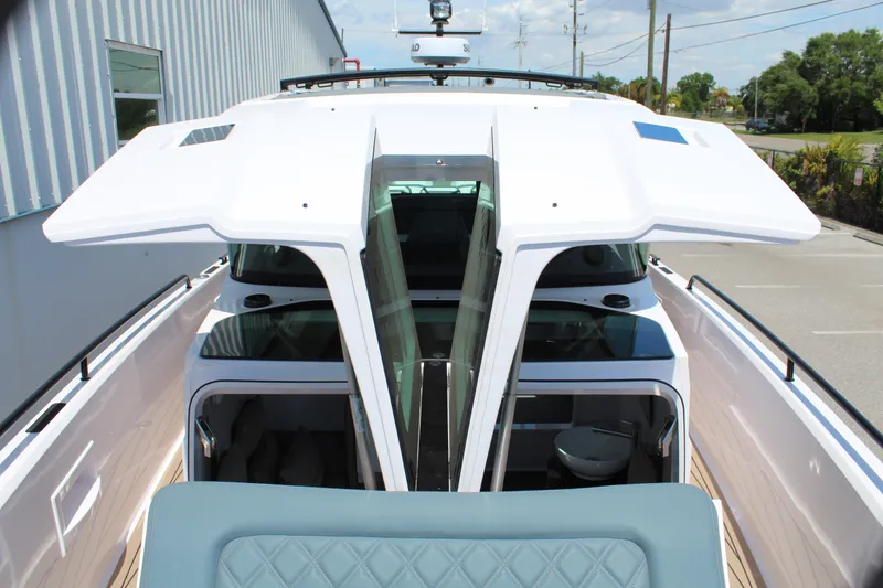 Slide: The Image of 2022 Axopar 37 XC Cross Cabin Brabus, top view of open cabin doors. - 35