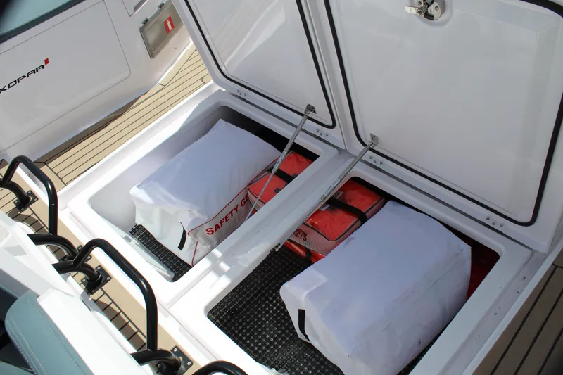 Slide: The Image of Storage compartments on the 2022 Axopar 37 XC Cross Cabin Brabus boat. - 32