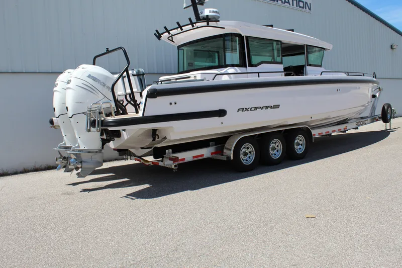 Slide: The Image of 2022 Axopar 37 XC Cross Cabin Brabus on a trailer, side view. - 5