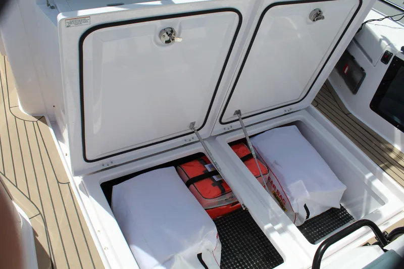 Slide: The Image of Storage compartments on the 2022 Axopar 37 XC Cross Cabin Brabus boat. - 33