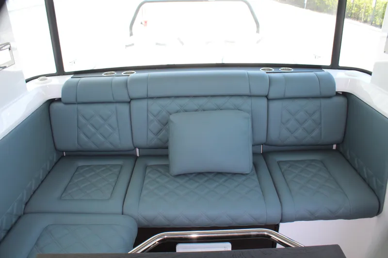 Slide: The Image of Luxurious seating area in the 2022 Axopar 37 XC Cross Cabin Brabus boat. - 49