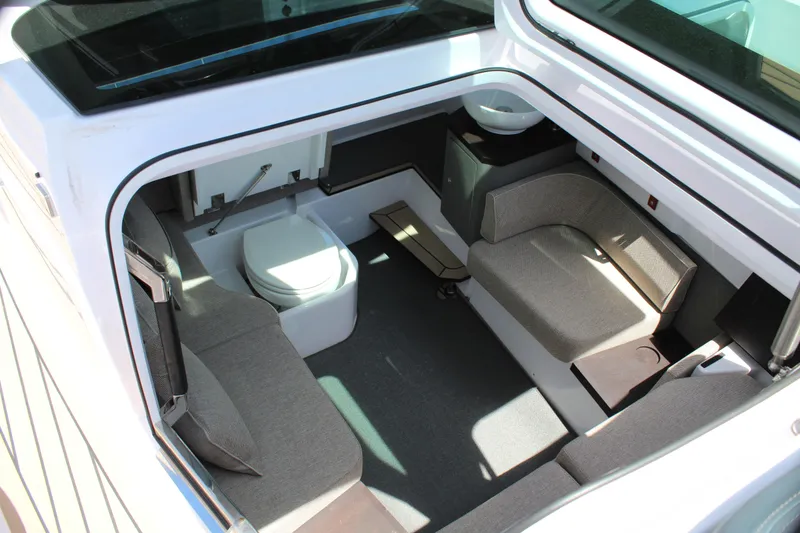 Slide: The Image of Interior cabin of 2022 Axopar 37 XC Cross Cabin Brabus with seating and toilet. - 29