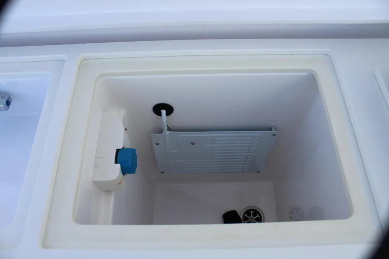 Slide: The Image of Built-in storage compartment in 2022 Axopar 37 XC Cross Cabin Brabus boat. - 27