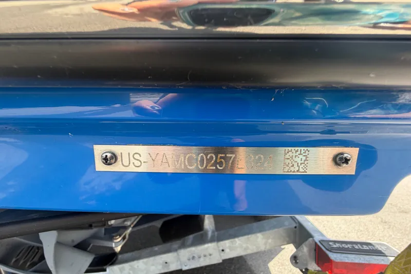 Slide: The Image of 2024 Yamaha Boats 222XD hull identification number plate on blue boat exterior. - 83