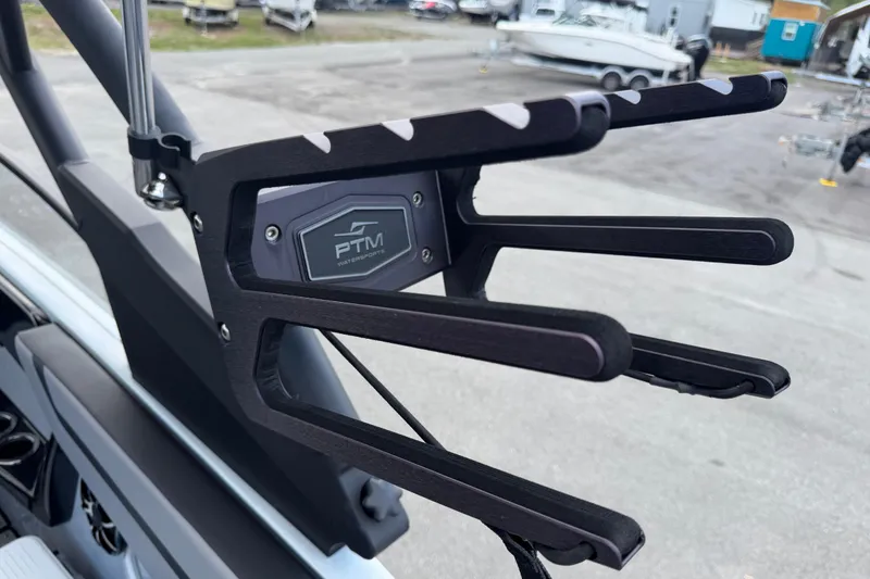 Slide: The Image of 2024 Yamaha Boats 222XD wakeboard rack by PTM Watersports, docked in a marina. - 79