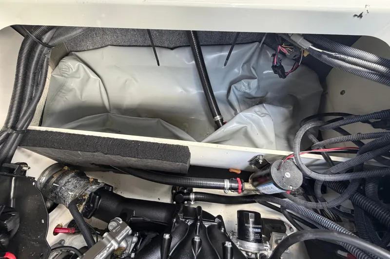 Slide: The Image of Engine compartment of 2024 Yamaha Boats 222XD, showcasing wiring and components. - 73
