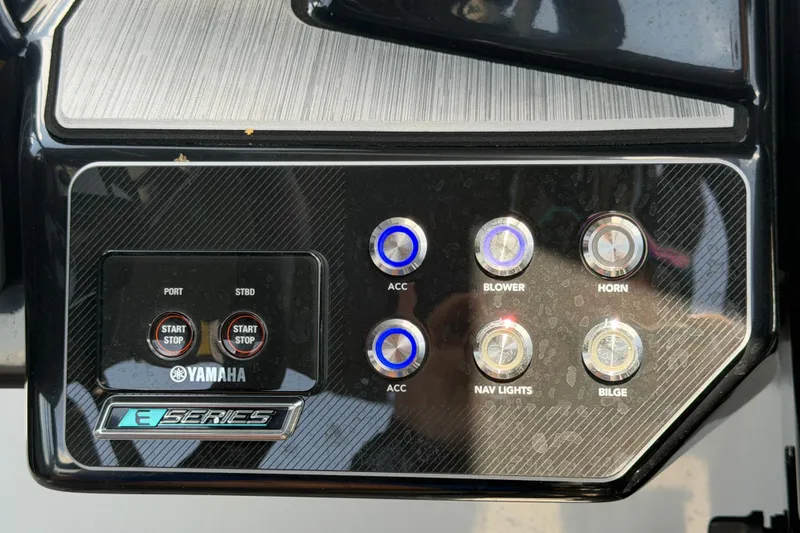 Slide: The Image of Control panel of 2024 Yamaha Boats 222XD with start/stop buttons and accessory switches. - 25