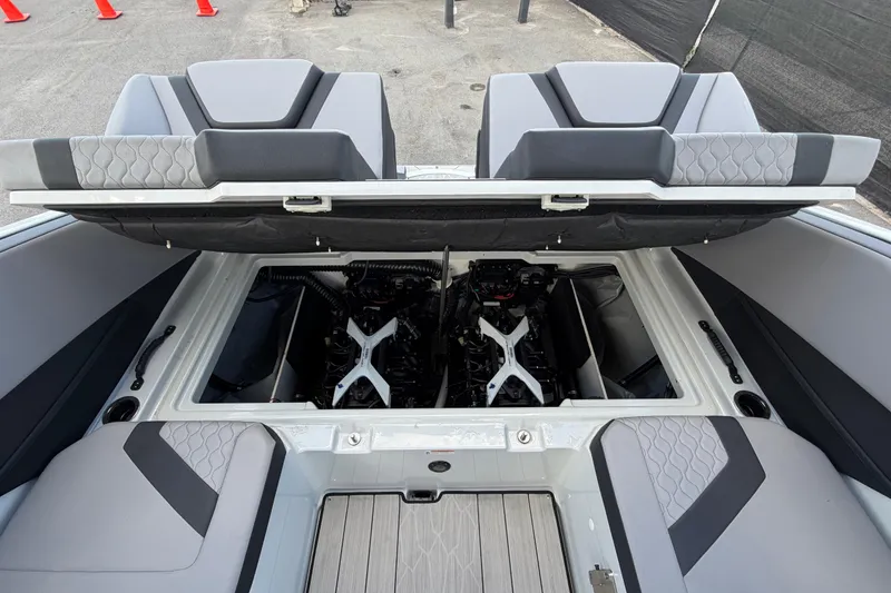 Slide: The Image of 2024 Yamaha Boats 222XD engine compartment with open hatch, showcasing dual engines. - 68