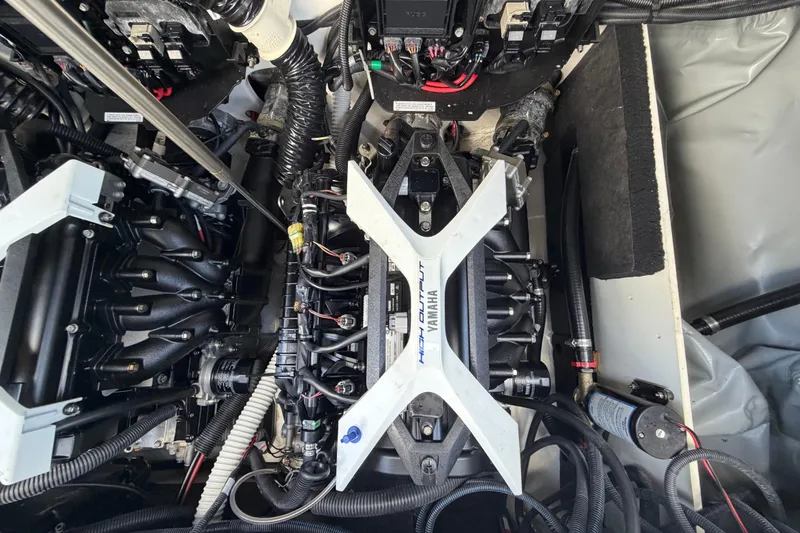 Slide: The Image of Engine compartment of 2024 Yamaha Boats 222XD, showcasing high-performance components and wiring. - 72