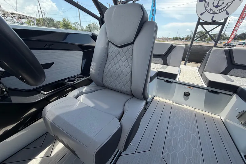 Slide: The Image of 2024 Yamaha Boats 222XD interior with gray seating and modern design. - 57