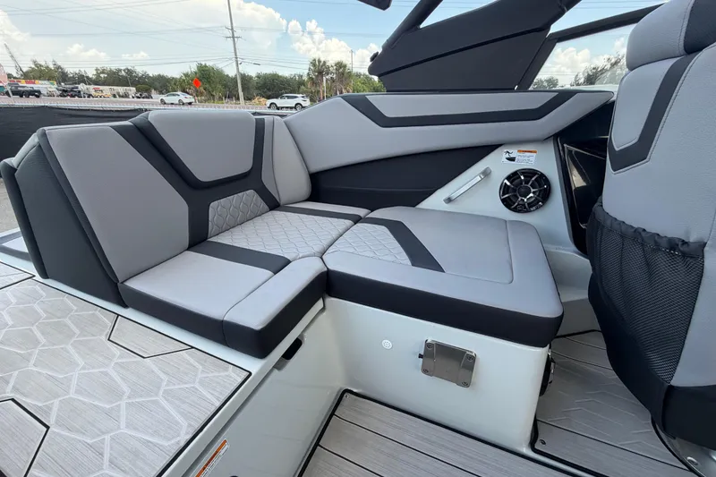 Slide: The Image of 2024 Yamaha Boats 222XD interior seating with modern design and speaker system. - 63