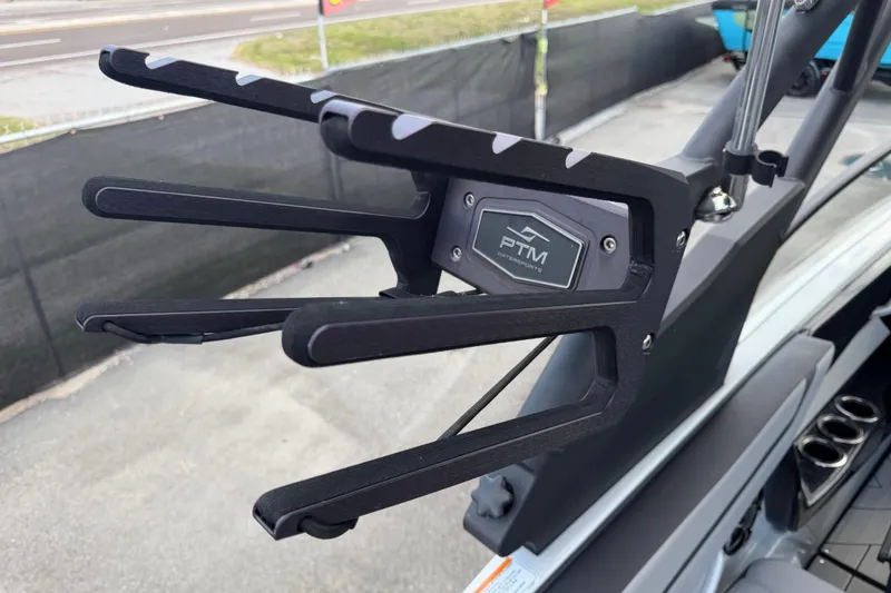 Slide: The Image of 2024 Yamaha Boats 222XD wakeboard rack with PTM Watersports branding, showcasing sleek design. - 80