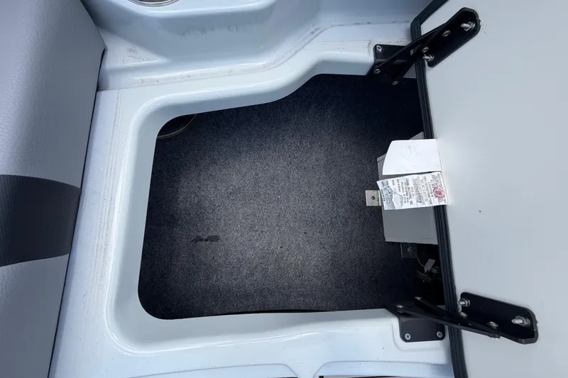 Slide: The Image of Open storage compartment in 2024 Yamaha Boats 222XD, showcasing interior space and design. - 48
