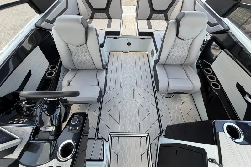 Slide: The Image of 2024 Yamaha Boats 222XD interior with sleek seating and modern dashboard design. - 54