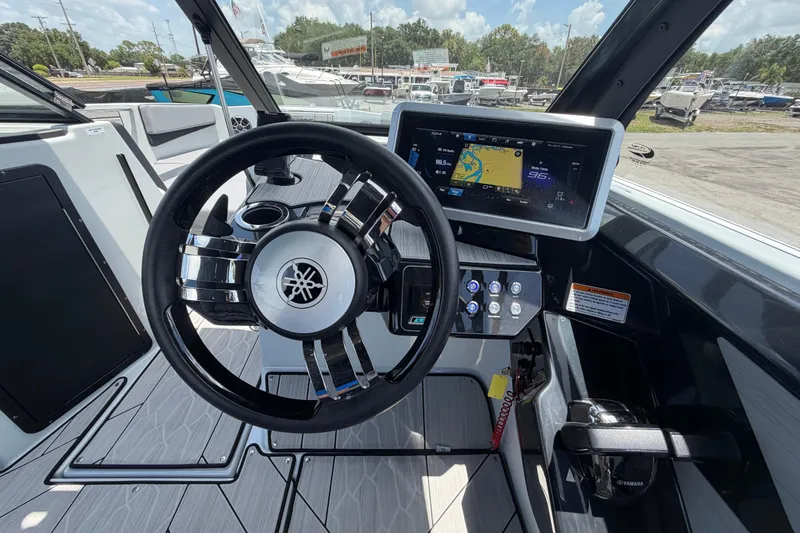 Slide: The Image of 2024 Yamaha Boats 222XD dashboard with steering wheel and digital display. - 22