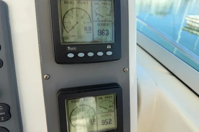 Slide: The Image of Close-up of 2007 Rampage 30 Express boat gauges displaying RPM and engine hours. - 31