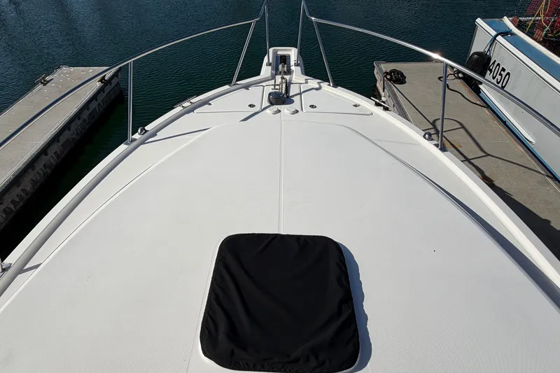 Slide: The Image of Bow view of 2007 Rampage 30 Express boat docked at marina. - 38
