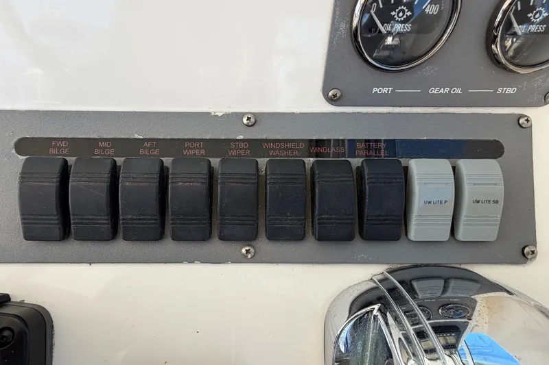 Slide: The Image of Control panel with toggle switches for bilge pumps, wipers, and other functions. - 33