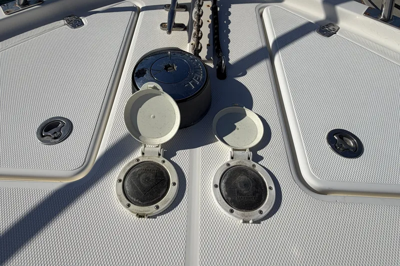 Slide: The Image of Deck of 2007 Rampage 30 Express boat with open hatches and anchor chain. - 41