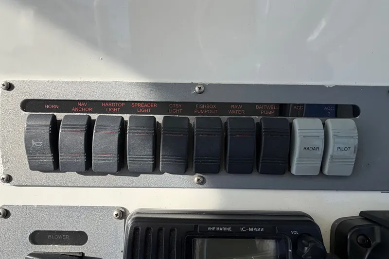 Slide: The Image of Control panel with various switches and a radio. - 32