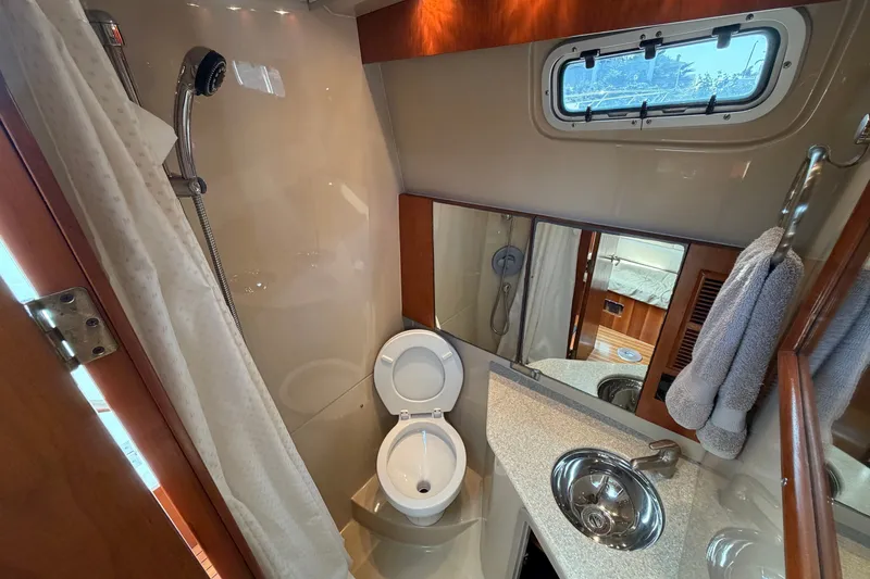 Slide: The Image of Luxurious bathroom in 2007 Rampage 30 Express yacht with shower, toilet, and sink. - 54