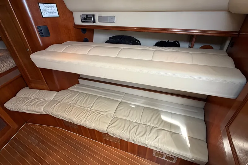 Slide: The Image of 2007 Rampage 30 Express cabin interior with beige leather seating and wooden accents. - 46