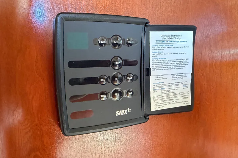 Slide: The Image of SMXir control panel on 2007 Rampage 30 Express boat, displaying operation instructions. - 52