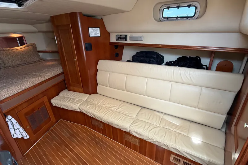 Slide: The Image of Luxurious interior of 2007 Rampage 30 Express boat with leather seating and cozy sleeping area. - 45