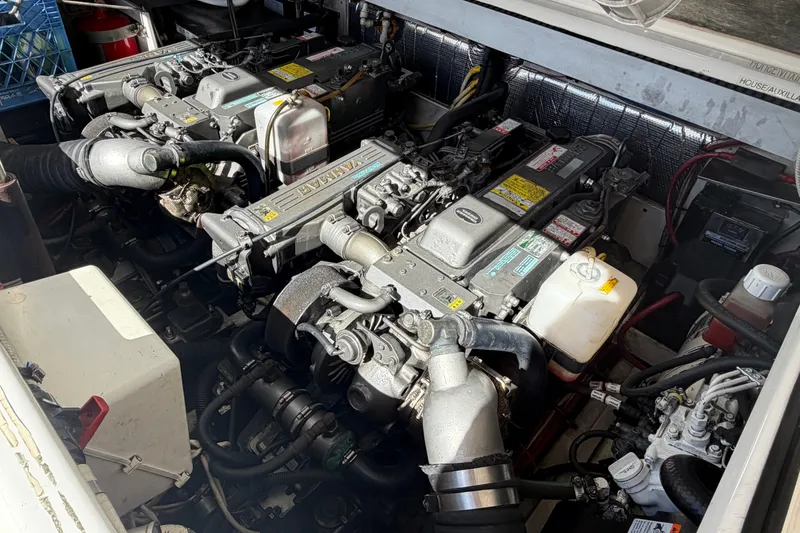 Slide: The Image of Engine compartment of a 2007 Rampage 30 Express boat, showcasing dual Yanmar engines. - 57