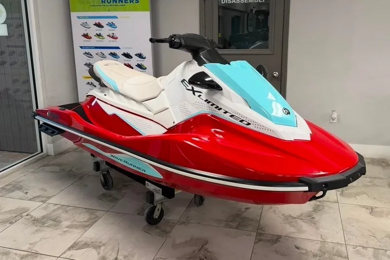 The Image of 2024 Yamaha WaveRunner EX Limited in showroom, red and white design. - 0