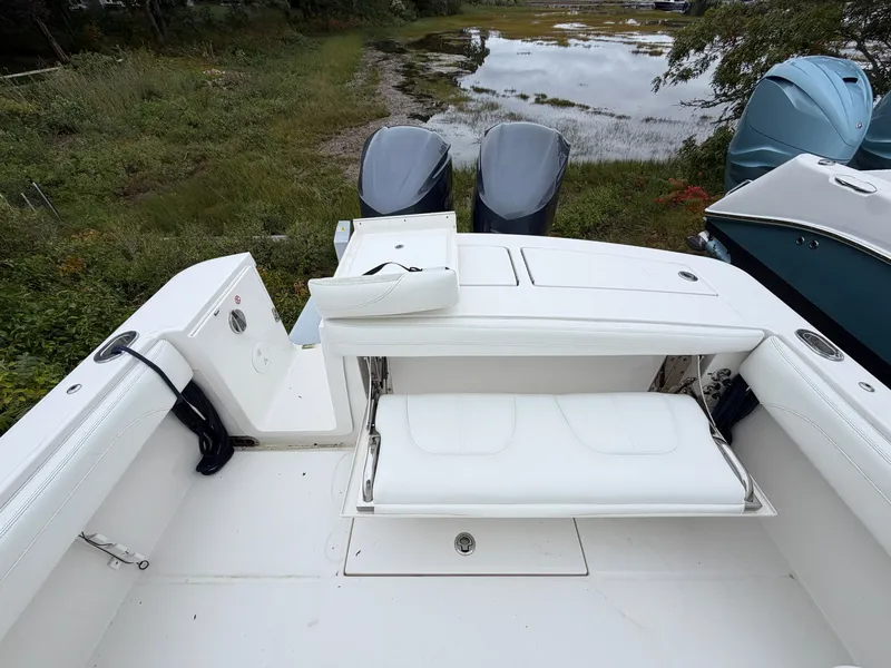 Slide: The Image of The image shows the stern of a 2021 Regulator 28 boat with two outboard engines. - 15