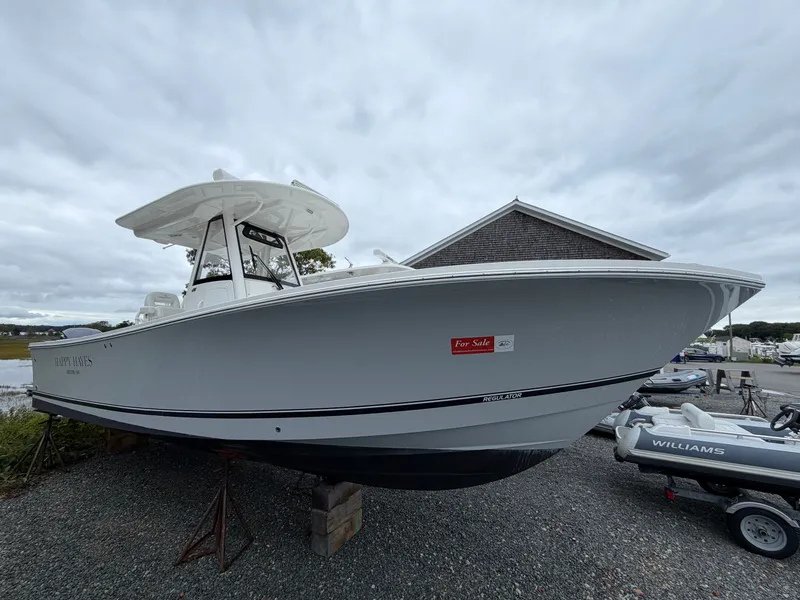 Slide: The Image of 2021 Regulator 28 on a boatyard, featuring a 'For Sale' sign. - 5