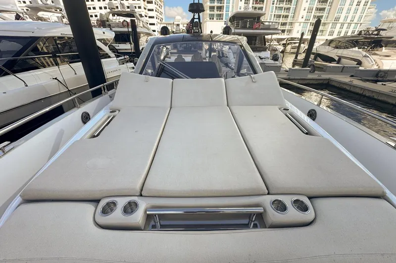 Slide: The Image of 2023 Azimut Verve 47 yacht with spacious sunbathing deck in marina setting. - 55