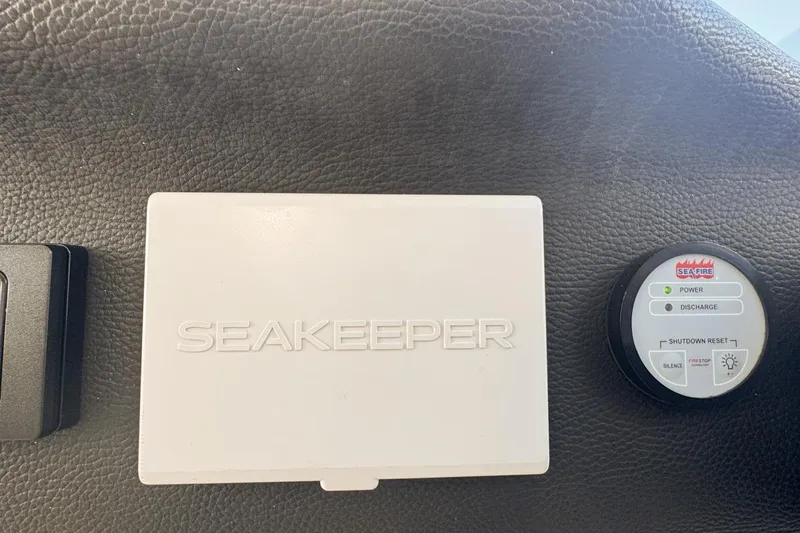 Slide: The Image of Seakeeper and Sea-Fire controls on 2023 Azimut Verve 47 yacht dashboard. - 45