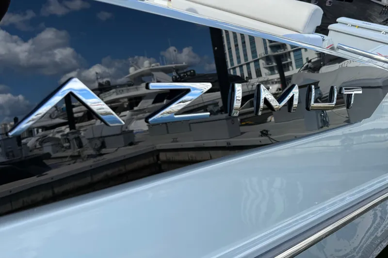 Slide: The Image of 2023 Azimut Verve 47 yacht logo with marina reflection. - 13