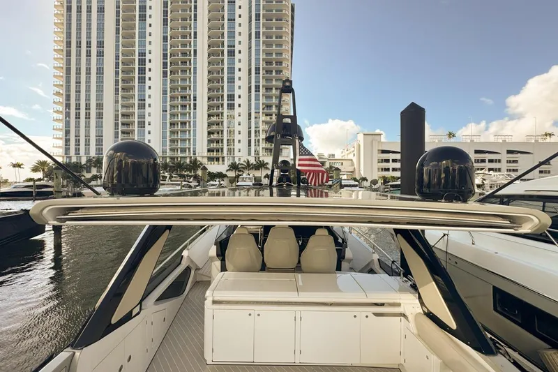 Slide: The Image of 2023 Azimut Verve 47 yacht docked near high-rise buildings, showcasing luxury design. - 19