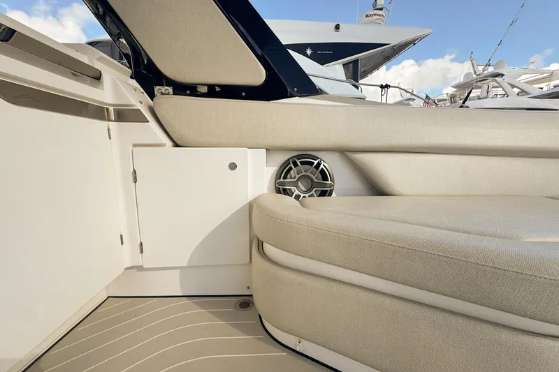 Slide: The Image of 2023 Azimut Verve 47 boat interior with beige seating and speaker detail. - 29