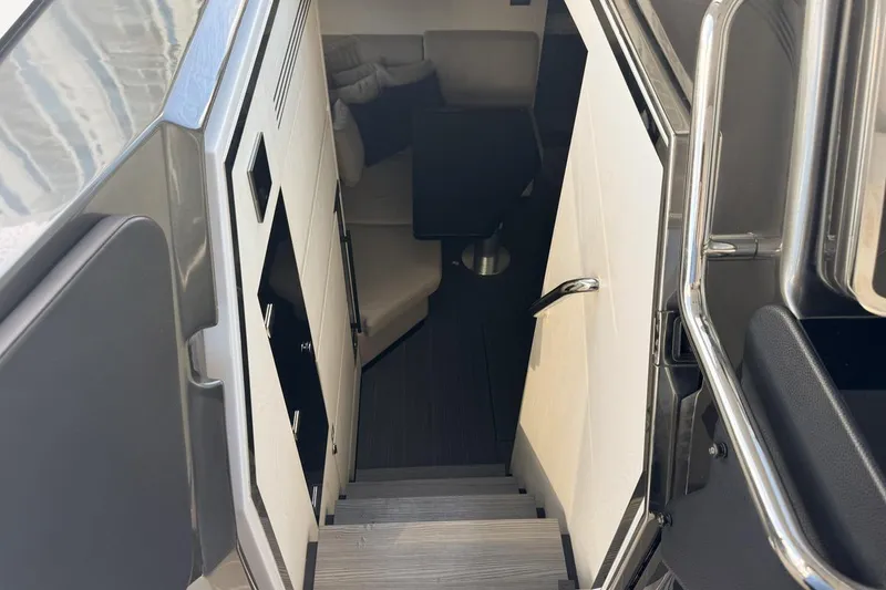 Slide: The Image of Interior view of 2023 Azimut Verve 47 yacht, showing stairs and seating area. - 65