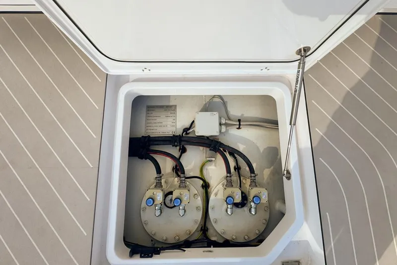 Slide: The Image of 2023 Azimut Verve 47 yacht engine compartment with visible wiring and components. - 27
