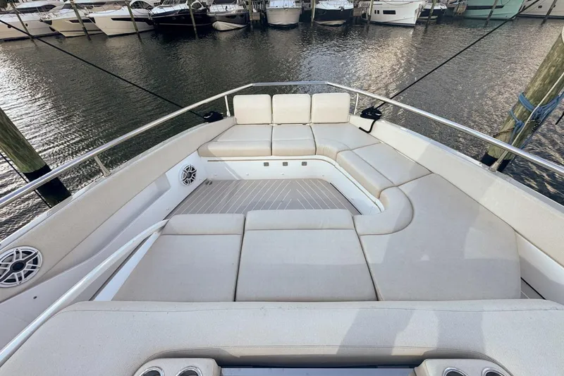 Slide: The Image of Luxurious seating area on 2023 Azimut Verve 47 yacht, docked at marina. - 49